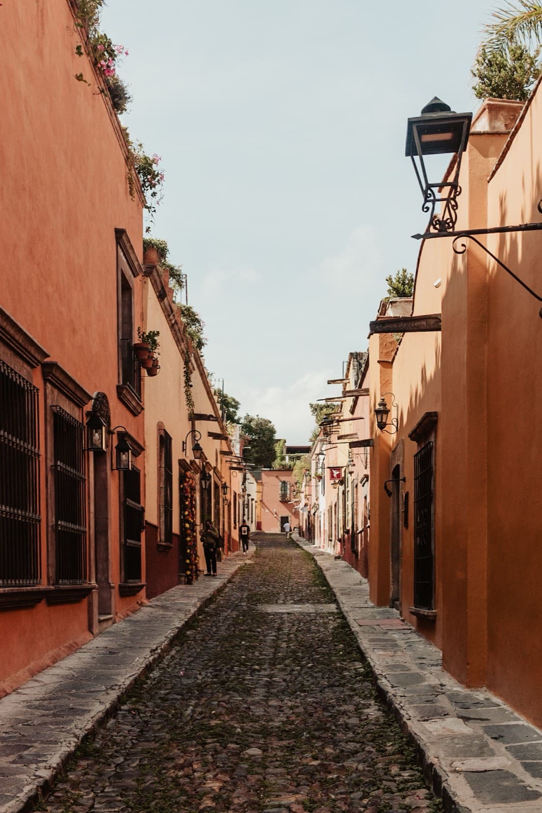 A narrow alley in rust and ochre tones in San Miguel de Allende